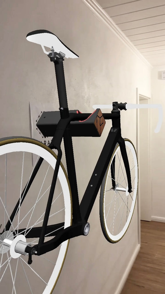 Schwarzes Augmented Reality Fahrrad auf schwarzer Fahrrad Wandhalterung D-RACK vor weißer Wand