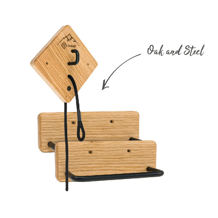 Bicycle wall mount U-RACK made of wood, black steel and black cord in front of white wall